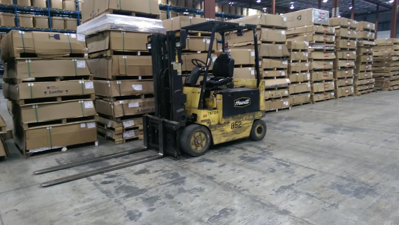 Forklift moving palletized freight